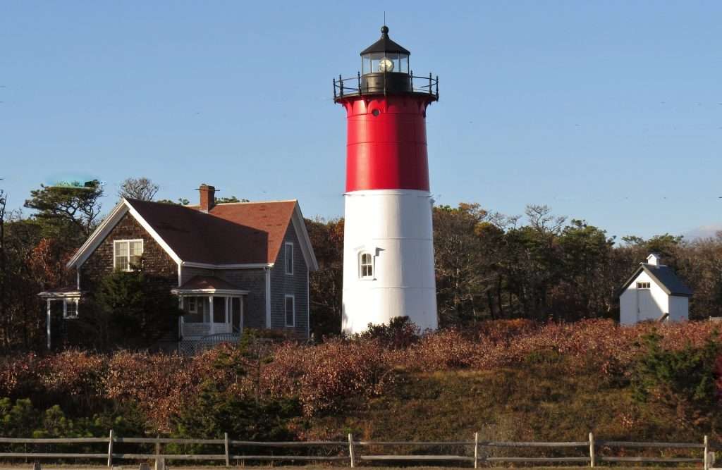 lighthouse and coastal home on cape cod